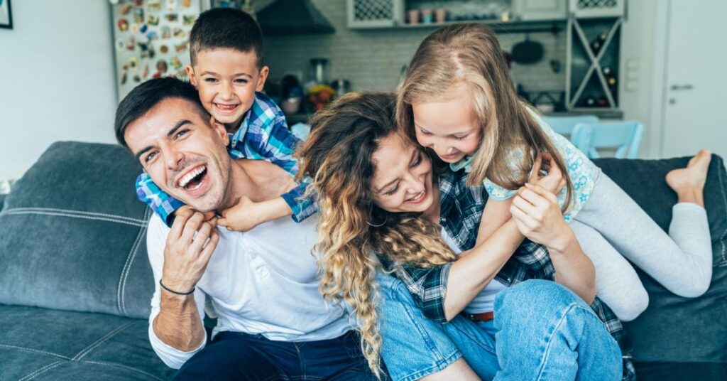 Family with children discussing health insurance plans with an advisor