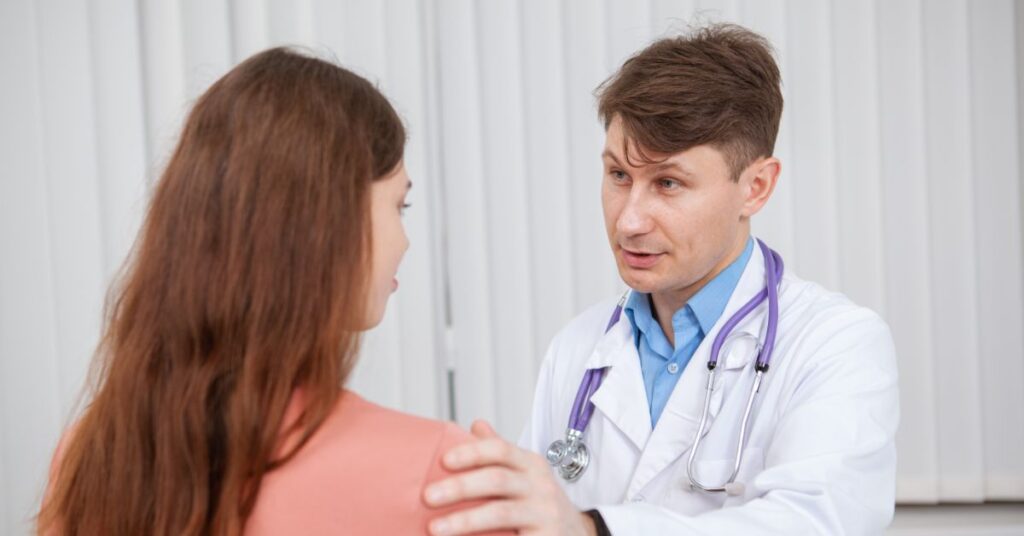 Patient consulting with doctor about major medical health insurance coverage